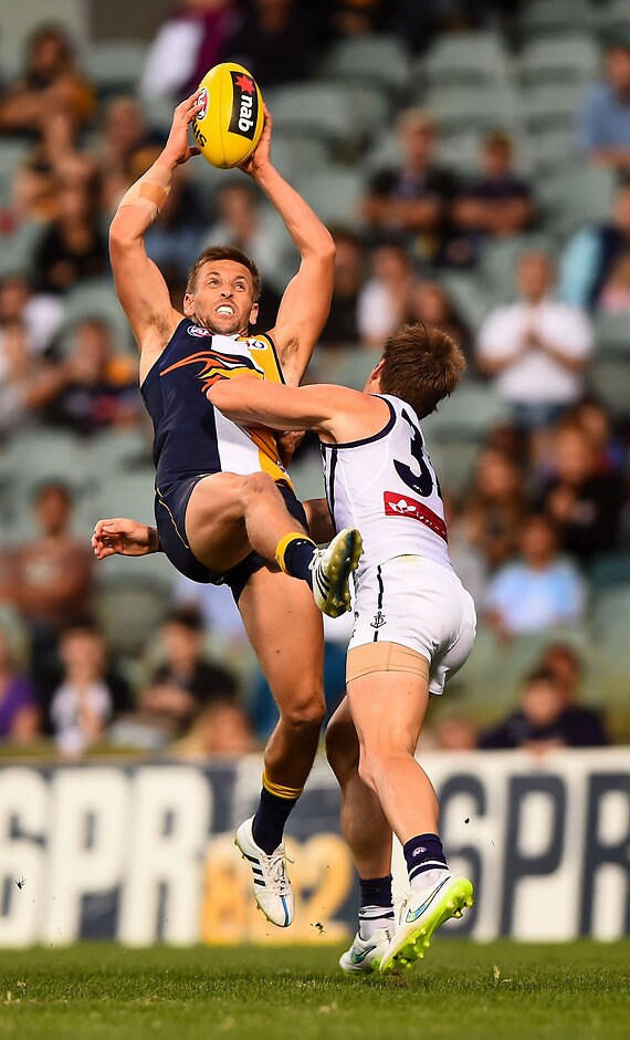 AFL 2015 NAB Challenge - West Coast v Fremantle Mark LeCras of the West Coast Eagles takes a mark falling back with the play during the 2015 NAB Challenge Week 4 match between the West Coast Eagles and the Fremantle Dockers at Patersons Stadium, Perth on March 22, 2015. (Photo: Daniel Carson/AFL Media)